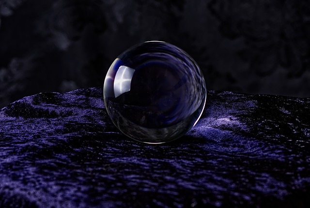 Crystal ball on dark purple background